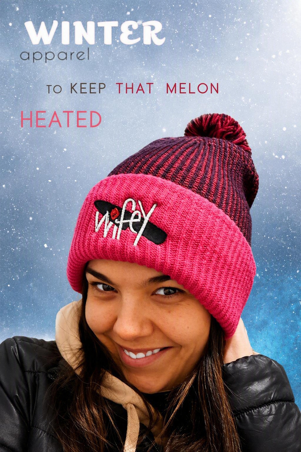 Ad still: a woman smiling in a pink and maroon pom-pom beanie carrying the Wifey wordmark, over a snowy background, headlined “Winter apparel to keep that melon heated”